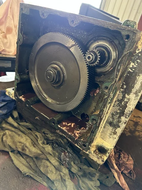 Open gearbox showing internal gears, shaft ends and bearing locations.
