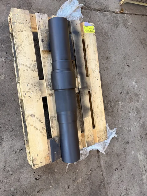 Second view of the dark-finished shaft and its stepped geometry.