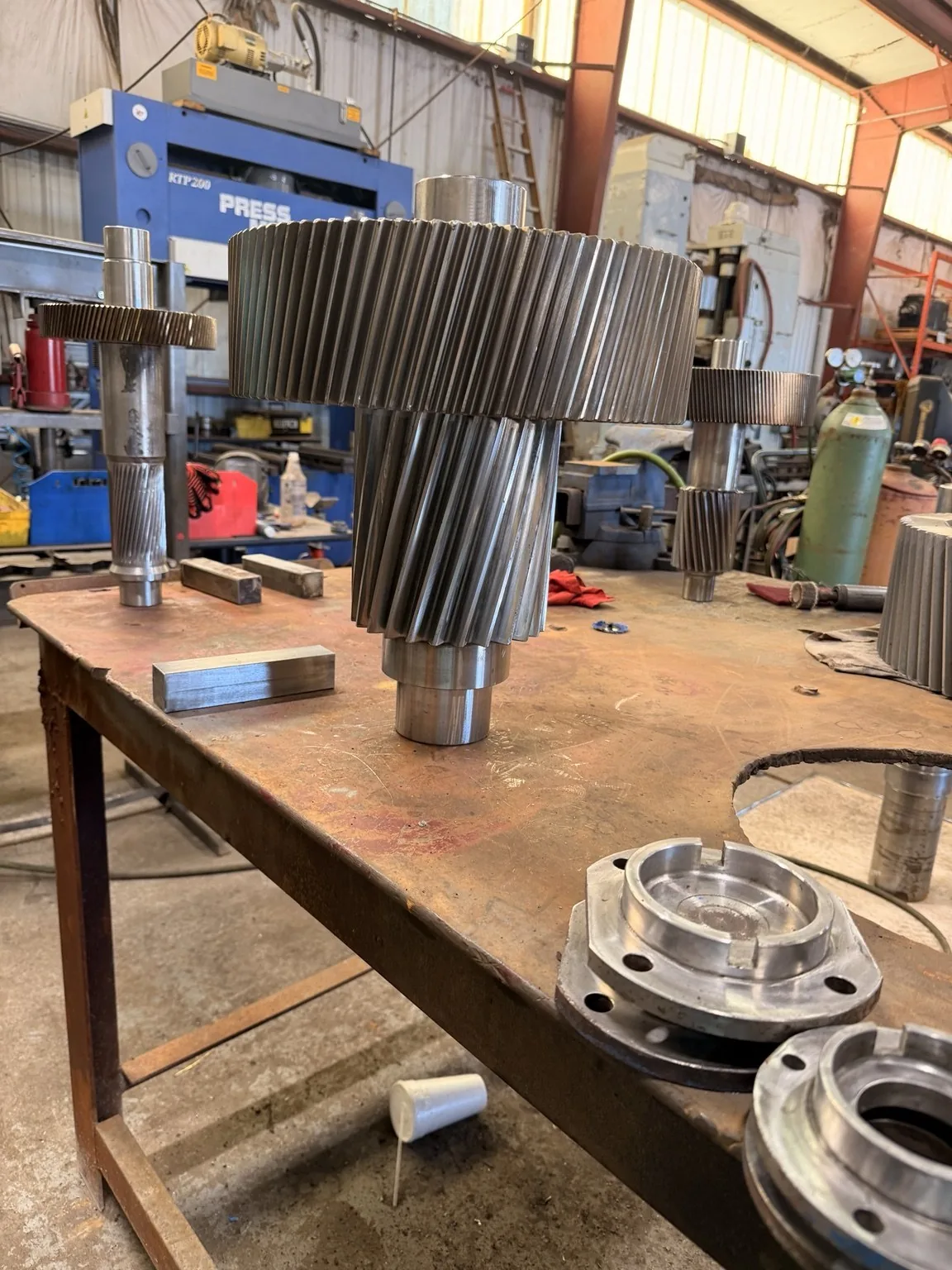 Gear-and-pinion assembly standing on the workbench.